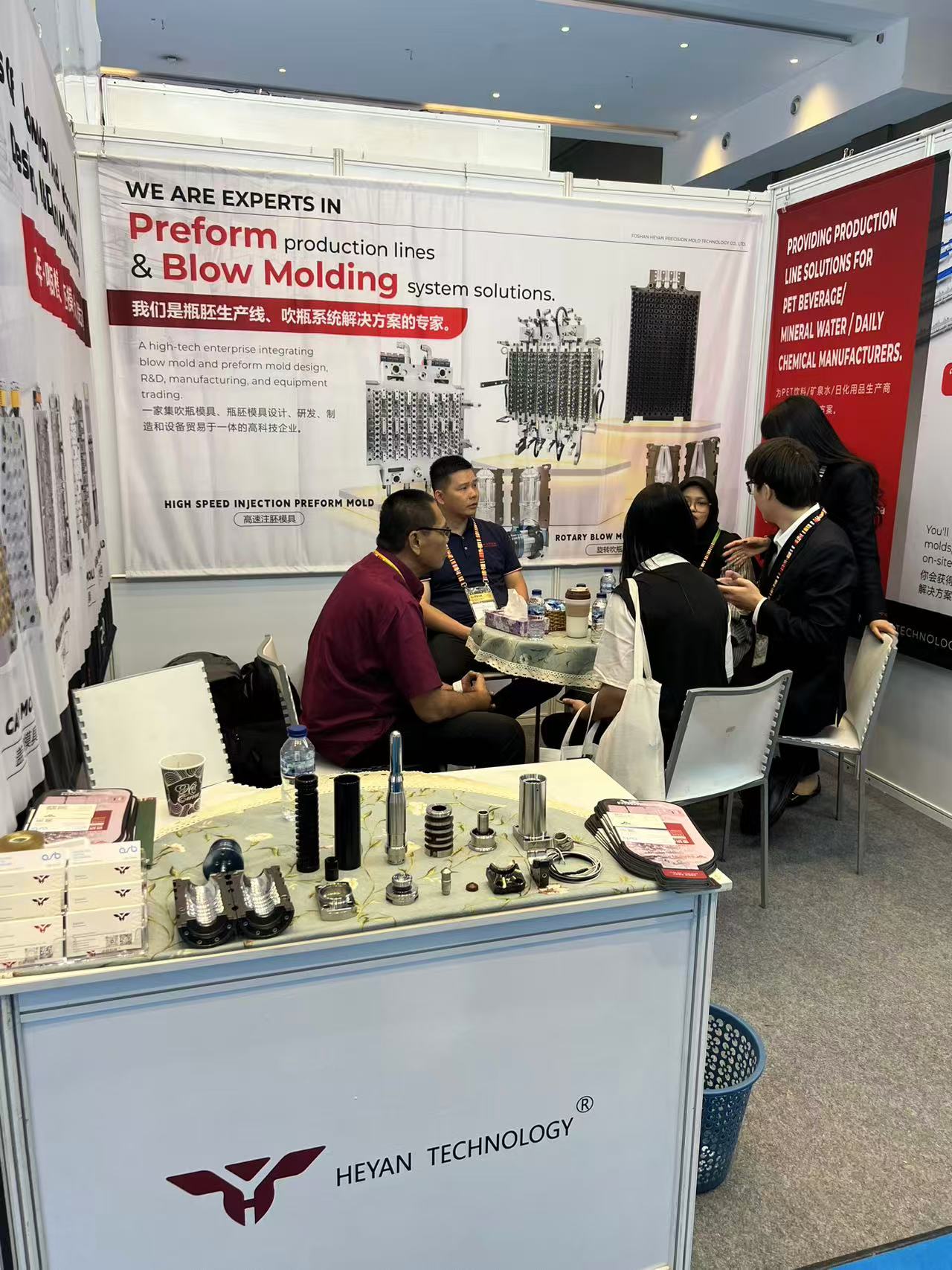 Heyan booth C3T320 at ALLPACK Indonesia 2026 showing PET preform molds on display