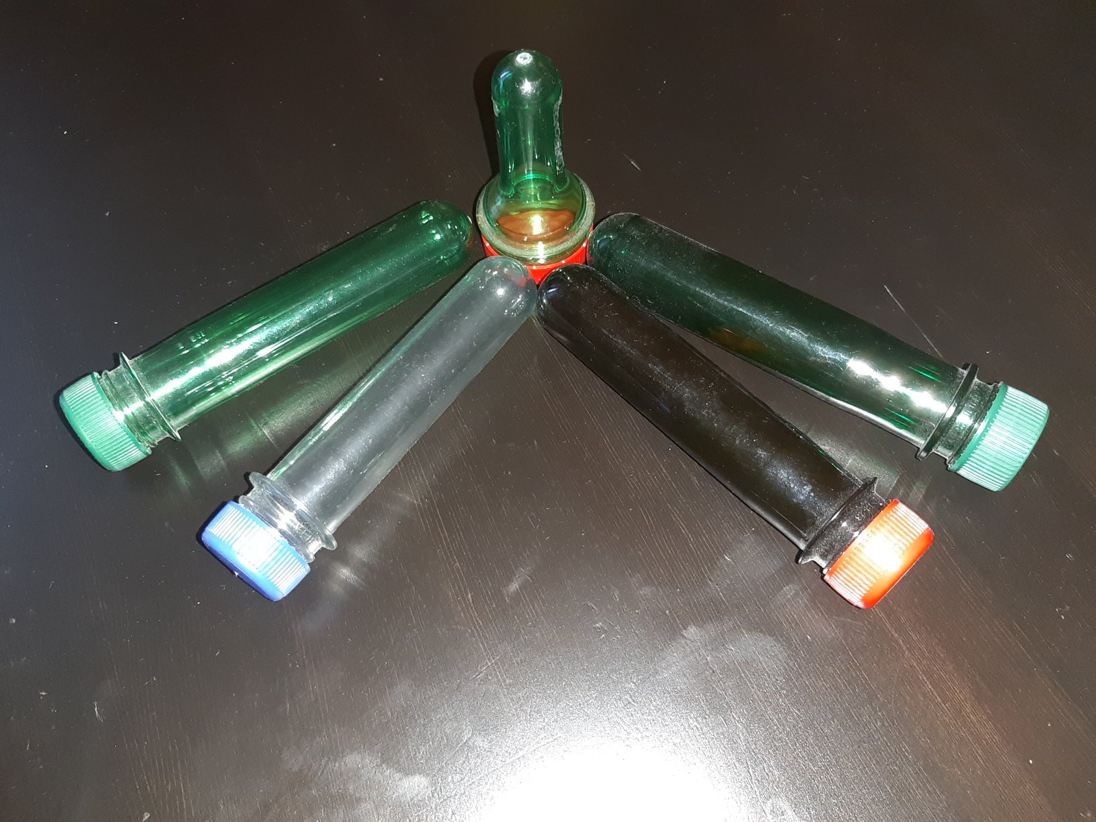Colored PET preforms with rounded closed ends